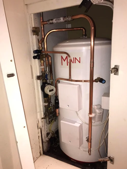 Main hot water cylinder install with copper pipework and isolation valves