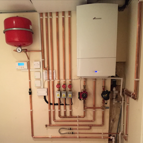 Worcester Bosch boiler installation with neat copper pipework and expansion vessel